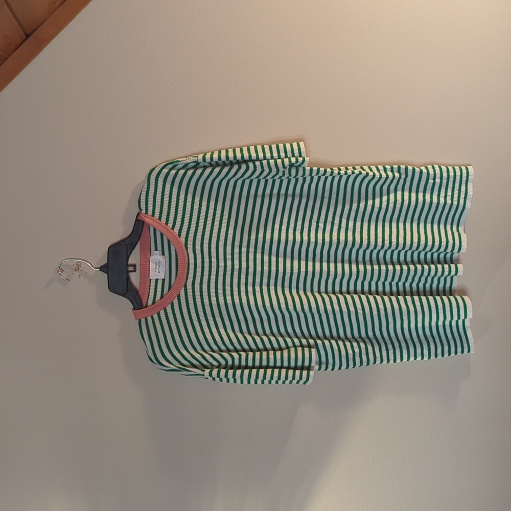 Never been worn tshirt, fits more like a xlarge